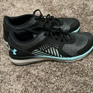Women’s black and blue Under Armour shoes